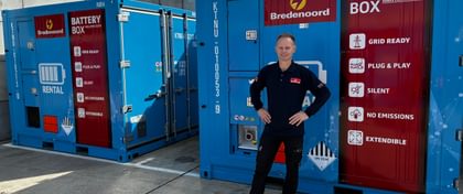 Trainer Patrick in front of batteries